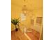 Elegant stairwell with wooden floors and decorative lighting, creating a warm and inviting ambiance at 94 Moury Se Ave, Atlanta, GA 30315