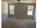 Large bedroom with two windows and carpet at 1835 Freeman Road, Jonesboro, GA 30236