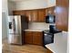 Kitchen features stainless steel appliances and wood cabinets at 1835 Freeman Road, Jonesboro, GA 30236