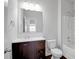 Well-lit bathroom featuring a dark vanity with a white countertop and a shower-tub combo at 2536 Dayview Ln, Atlanta, GA 30331