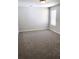 Bedroom featuring plush gray carpet, neutral walls, and a bright window with natural light at 2536 Dayview Ln, Atlanta, GA 30331