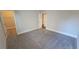 Bedroom with an open closet featuring plush gray carpet and neutral walls at 2536 Dayview Ln, Atlanta, GA 30331