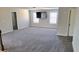 Comfortable bonus room featuring plush gray carpet, a television on the wall, and bright windows at 2536 Dayview Ln, Atlanta, GA 30331