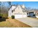 Well-maintained two-story home with a two-car garage and green lawn, creating a welcoming curb appeal at 2536 Dayview Ln, Atlanta, GA 30331