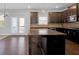 Spacious kitchen featuring a center island with granite countertops, dark wood cabinets, and stainless steel appliances at 2536 Dayview Ln, Atlanta, GA 30331