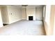 Spacious living room with neutral carpeting, a fireplace, and natural light at 2536 Dayview Ln, Atlanta, GA 30331