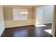 Open-concept living room featuring coffered ceilings, wainscoting and hardwood floors at 2536 Dayview Ln, Atlanta, GA 30331