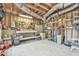 Spacious unfinished basement featuring exposed ceiling, workbench, and storage shelves at 2548 Brentmoor Ct, Suwanee, GA 30024