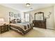 Serene bedroom with classic furnishings and a decorative mirror, creating a peaceful retreat at 2548 Brentmoor Ct, Suwanee, GA 30024