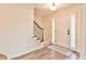 Bright foyer features hardwood flooring, a staircase, and a well-lit entryway at 2548 Brentmoor Ct, Suwanee, GA 30024