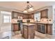 Stylish kitchen with wood cabinets, an island, and stainless steel appliances at 2548 Brentmoor Ct, Suwanee, GA 30024