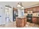 Lovely kitchen with a center island, stainless steel appliances, and modern lighting at 2548 Brentmoor Ct, Suwanee, GA 30024