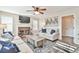 Well-lit living room featuring a fireplace and contemporary décor, creating a welcoming space at 2548 Brentmoor Ct, Suwanee, GA 30024