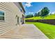 Back exterior featuring a wooden deck with ample green space and lush landscaping at 8051 Nolan Trl, Snellville, GA 30039