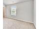 Neutral bedroom with carpet, window, and a light-colored neutral paint at 8051 Nolan Trl, Snellville, GA 30039