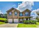 Charming two-story brick home with a well-manicured lawn, covered entry, and a two-car garage at 8051 Nolan Trl, Snellville, GA 30039