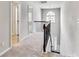 Upstairs hallway with wood railing, carpeted floor, and large window at 8051 Nolan Trl, Snellville, GA 30039