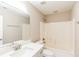 Clean bathroom with a shower/tub combo and white vanity at 1107 E Shoreview Rd, Mcdonough, GA 30253