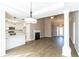 Open concept kitchen and dining area with hardwood floors and modern appliances at 1107 E Shoreview Rd, Mcdonough, GA 30253