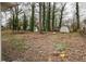 Backyard with sheds and trees at 6565 Bussell Way, Riverdale, GA 30274