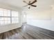 Living space with lots of natural light, modern ceiling fan, and gray wood-look flooring at 1752 Sw Pryor Sw Rd # 105, Atlanta, GA 30315