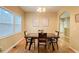 Bright dining room features hardwood floors and a wood table with four chairs at 2650 Batavia St, East Point, GA 30344