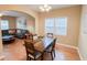 Open concept dining room with view into living room and hardwood floors at 2650 Batavia St, East Point, GA 30344