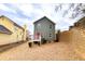 Two-story house with gray siding, red door, and small deck at 2650 Batavia St, East Point, GA 30344