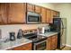 Kitchen boasts stainless steel appliances and granite countertops at 2650 Batavia St, East Point, GA 30344