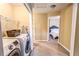 Bright laundry room with washer, dryer and storage at 2650 Batavia St, East Point, GA 30344