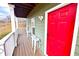 Front porch with white railings and red door at 2650 Batavia St, East Point, GA 30344