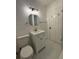 Modern bathroom with white vanity, gold fixtures, and marble flooring at 2773 Fairlane Dr, Atlanta, GA 30354