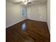 Spacious bedroom features hardwood floors, a ceiling fan, and natural light from a window at 2773 Fairlane Dr, Atlanta, GA 30354