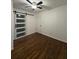 Bedroom with dark hardwood floors, white wainscoting and barn door at 2773 Fairlane Dr, Atlanta, GA 30354