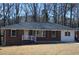 Brick ranch home with a gray roof, white porch railing, and a well-maintained lawn at 2773 Fairlane Dr, Atlanta, GA 30354