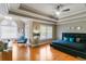 Tranquil bedroom with tray ceilings, hardwood floors, and modern decor at 313 Young James Cir, Stockbridge, GA 30281