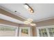 Stylish dining area featuring modern lighting fixtures and expansive windows at 313 Young James Cir, Stockbridge, GA 30281