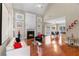 Bright and open living room with hardwood floors, a fireplace, and modern decor at 313 Young James Cir, Stockbridge, GA 30281