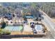 An aerial view showcases community amenities: swimming pool and tennis courts for active lifestyles at 4011 Charrwood Trce, Marietta, GA 30062