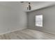 Neutral bedroom with light-wood floors, a modern chandelier, and natural light at 4011 Charrwood Trce, Marietta, GA 30062