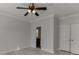 A spacious bedroom with light hardwood floors and a ceiling fan at 4011 Charrwood Trce, Marietta, GA 30062