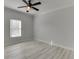 A bright bedroom with light hardwood floors and large windows at 4011 Charrwood Trce, Marietta, GA 30062