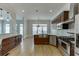 Modern kitchen with stainless steel appliances, granite countertops, and custom cabinetry at 4011 Charrwood Trce, Marietta, GA 30062