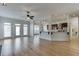 Spacious living room with hardwood floors, lots of windows, and modern kitchen at 4011 Charrwood Trce, Marietta, GA 30062