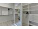 Spacious walk-in closet with built-in shelving, drawers, and a full-length mirror at 4011 Charrwood Trce, Marietta, GA 30062