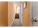 Light-filled entry hall with carpeted flooring and staircase at 2270 Washington Dr, Douglasville, GA 30135