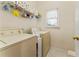 Convenient laundry room with washer, dryer, and storage at 2270 Washington Dr, Douglasville, GA 30135