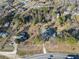 Aerial view of house and surrounding lot, showing nearby homes and road at 2555 Klondike Sw Rd, Conyers, GA 30094