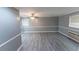 Living room with gray walls and wood-look floors at 2555 Klondike Rd Sw, Conyers, GA 30094