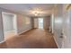 Living room with neutral carpeting and ceiling fan at 2555 Klondike Rd Sw, Conyers, GA 30094